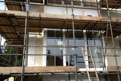 Sash window repair house with scaffolding