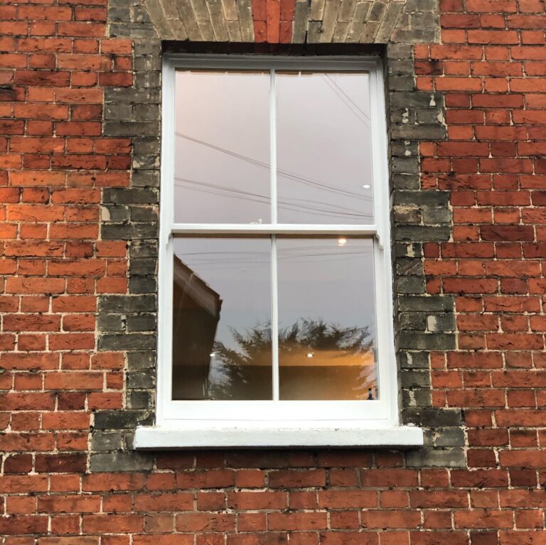 Installation of new hard wood sash windows with double glazed laminated