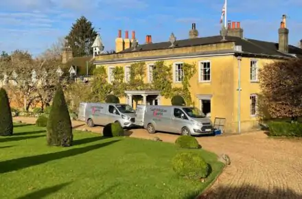 Sash Window Experts parked outside listed building in Surrey